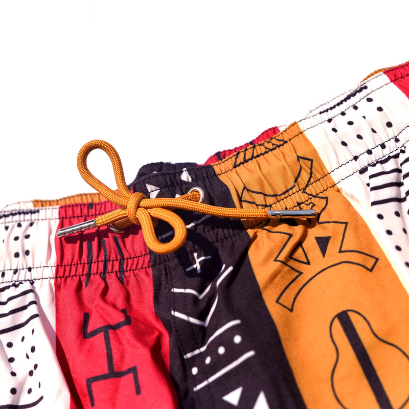 DIOP black-owned brand presents their 6" swim trunks with African patterns, perfect for any beach or pool day. The swim trunks are made with high-quality material and feature unique African-inspired designs, adding an extra touch of style to your swimwear collection.